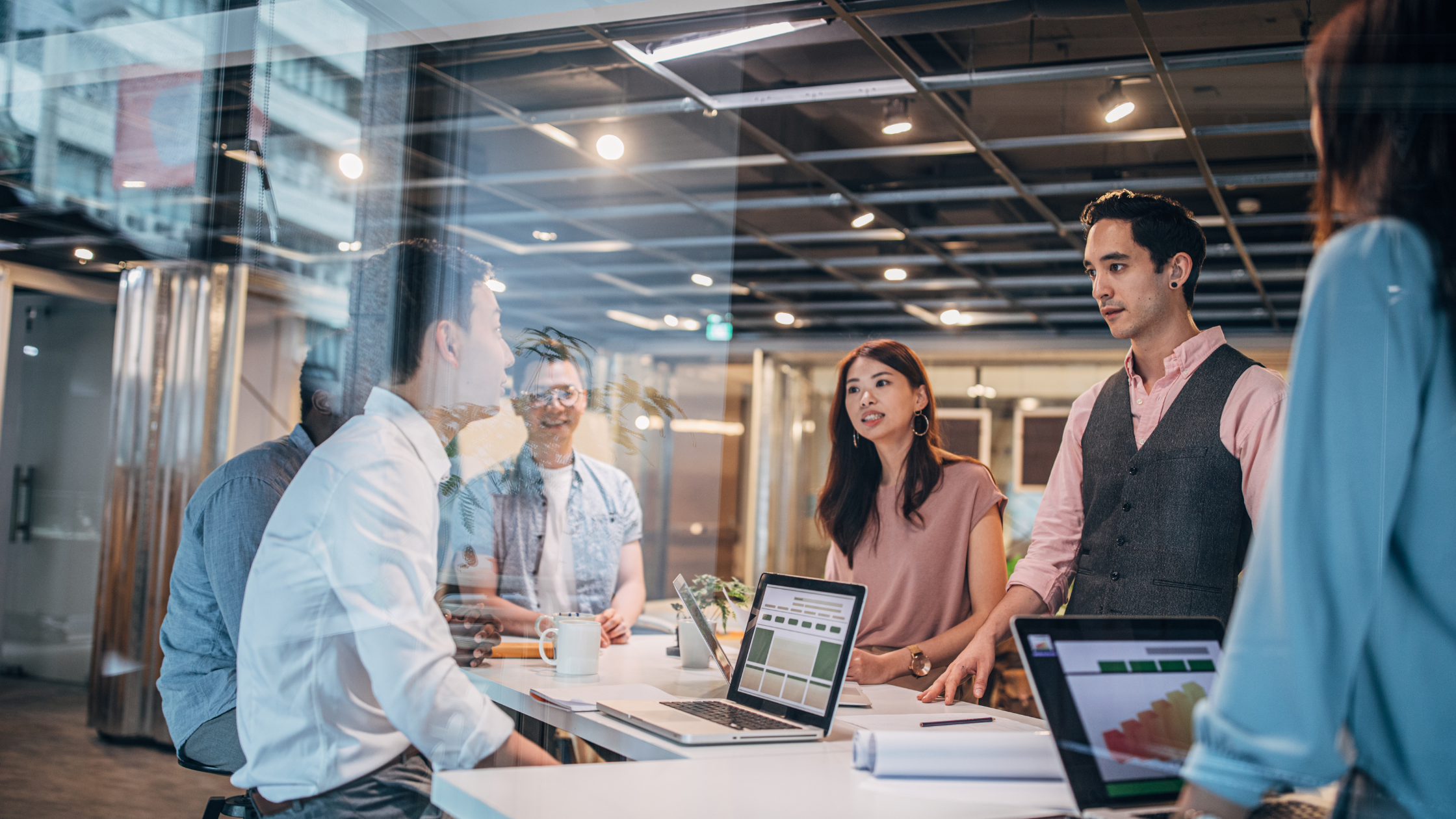 Young multi-ethnic group of people working in modern office.