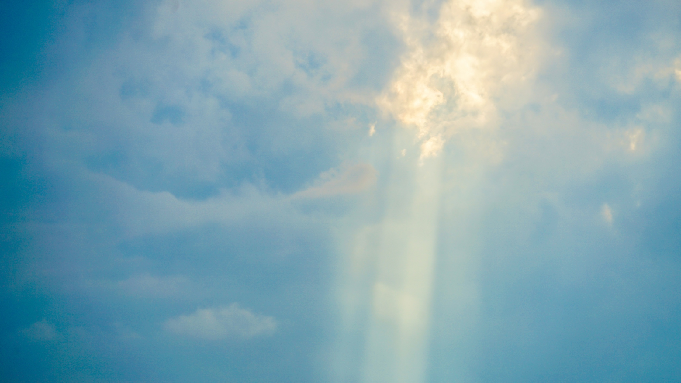 Sunlight Rays Breaking Through Clouds